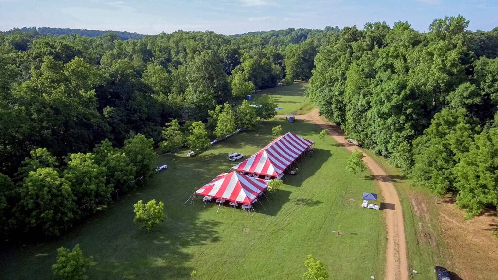 A drone shot of the tent during the setup of the sacred selections adoption event